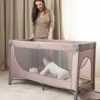 Cuna plegable de viaje con apertura lateral